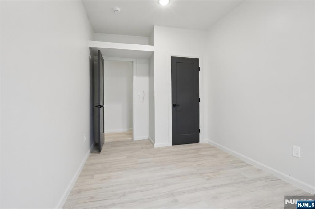 542 East 25th Street, Unit 540 Paterson, NJ 07514 - Photo 10 of 11 a view of a room with wooden floor