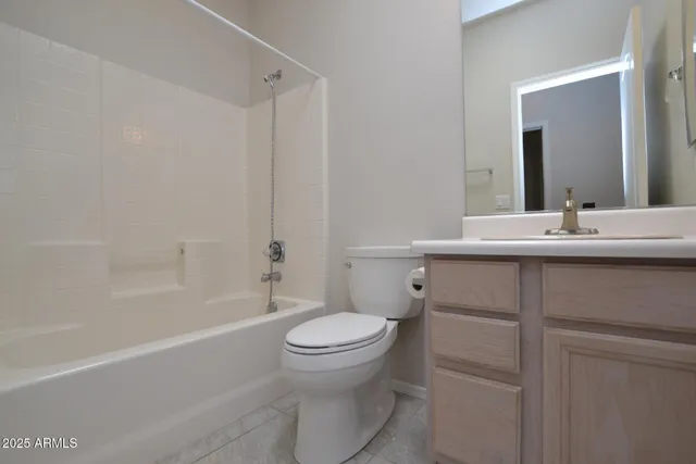 a bathroom with a sink toilet vanity and shower