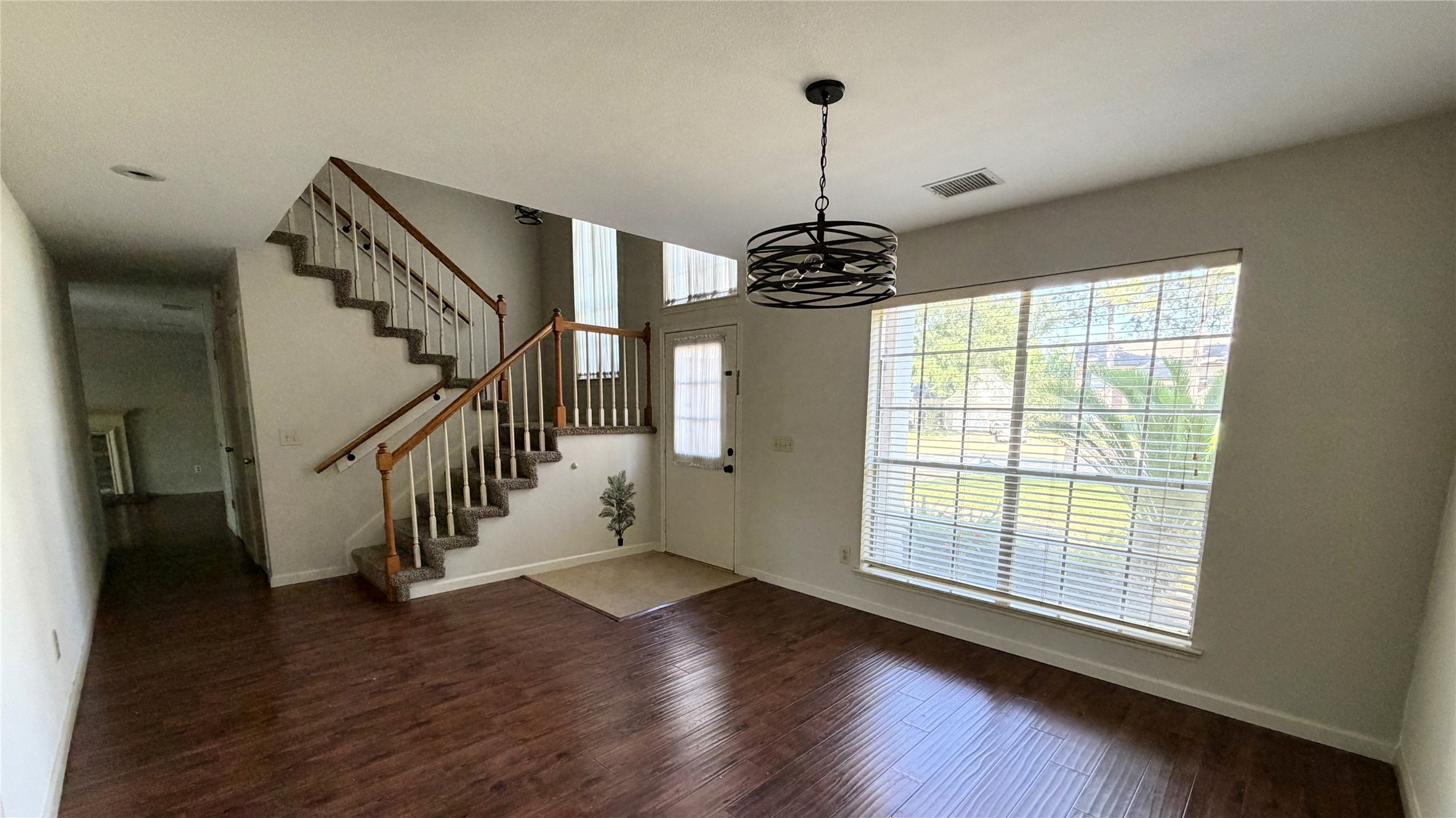 7771 Springville Drive Houston, TX 77095 - Photo 3 of 13 Sunlit living area with expansive windows.