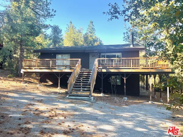 a front view of a house with parking