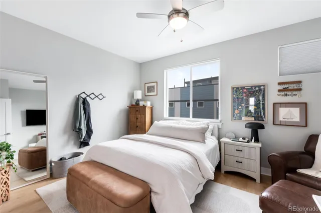 a bedroom with a bed and a couch