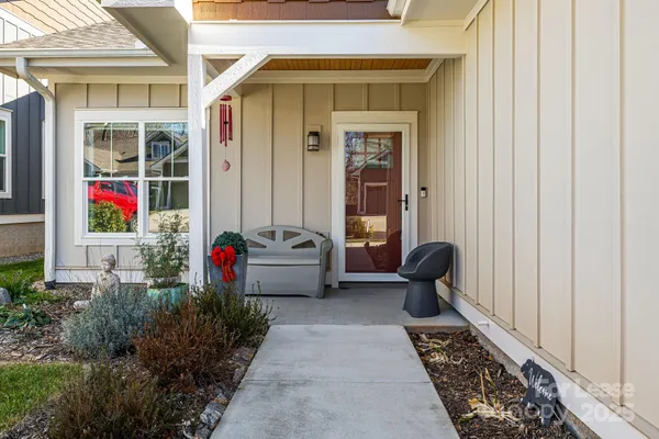 a view of a bench sitting in front of a house