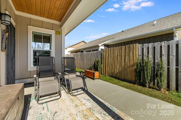 a view of backyard with a patio