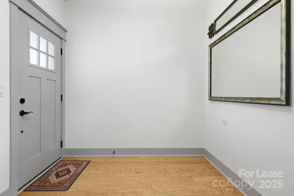 a living room with furniture fireplace and a window