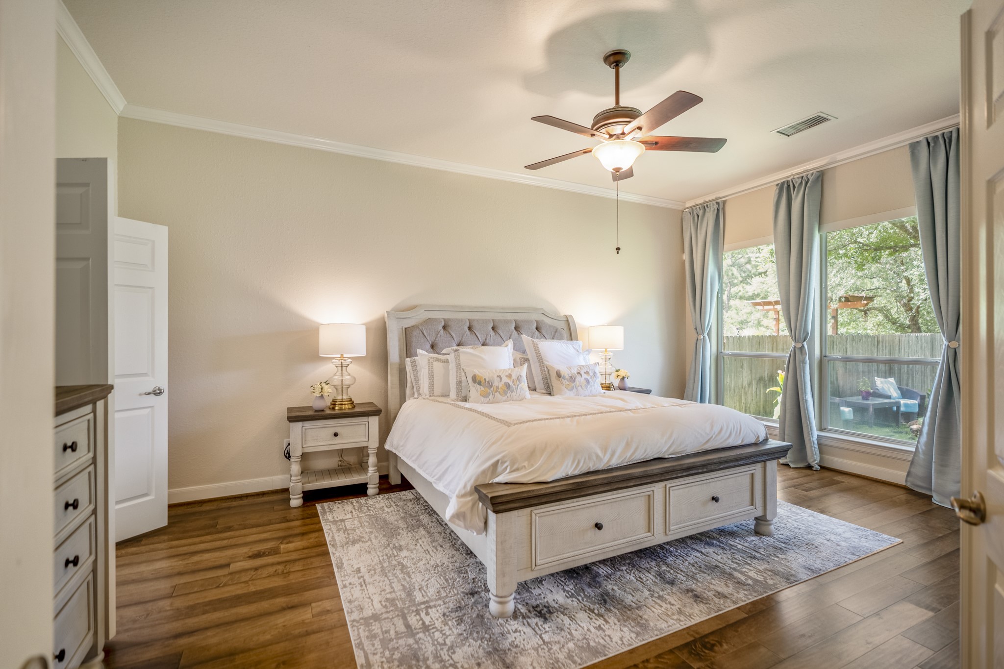 67 North Pentenwell Circle Spring, TX 77382 - Photo 17 of 50 a large bedroom with a bed and wooden floor