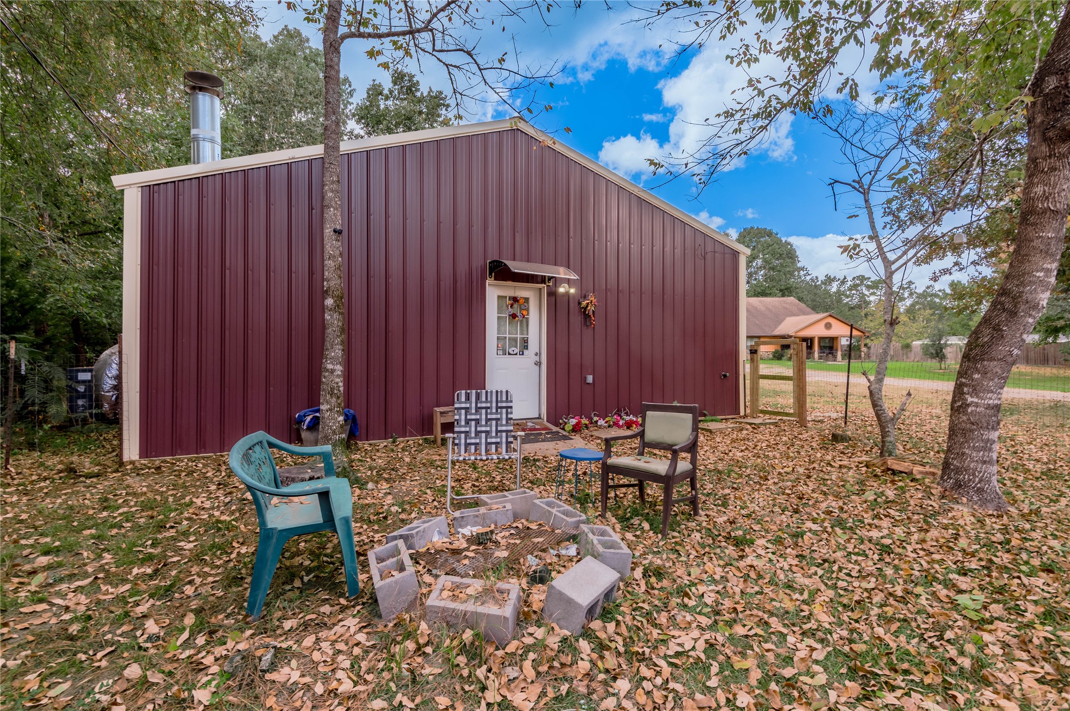47-57 Stage Coach Road Coldspring, TX 77331 - Photo 34 of 50 a backyard of a house with outdoor seating