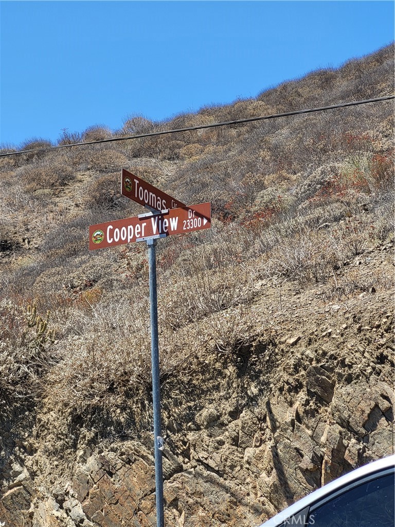 a view of a street with a building in the background