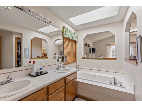 261 Southwest Nancy Circle Gresham, OR 97030 - Photo 13 of 25 a bathroom with a sink double vanity granite and a mirror
