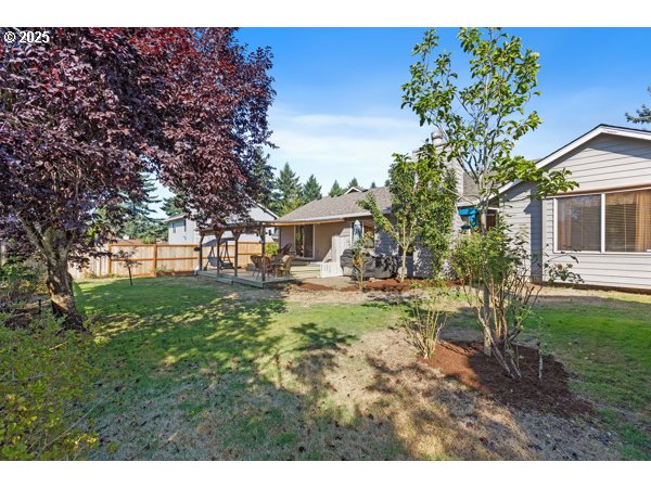 261 Southwest Nancy Circle Gresham, OR 97030 - Photo 20 of 25 a view of house with backyard and a tree