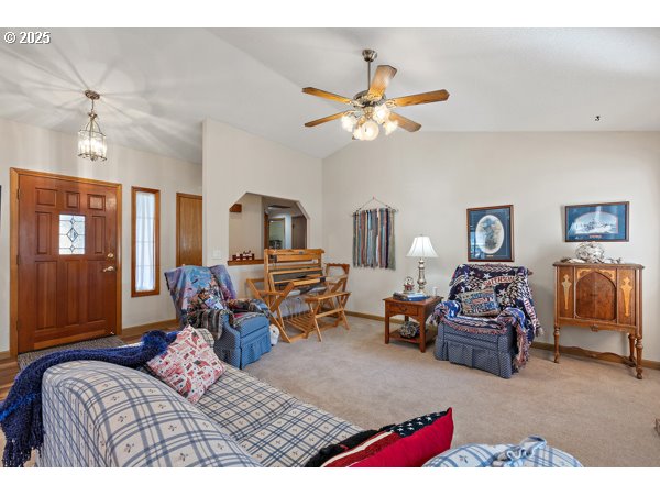 261 Southwest Nancy Circle Gresham, OR 97030 - Photo 4 of 25 a bedroom with furniture and a chandelier