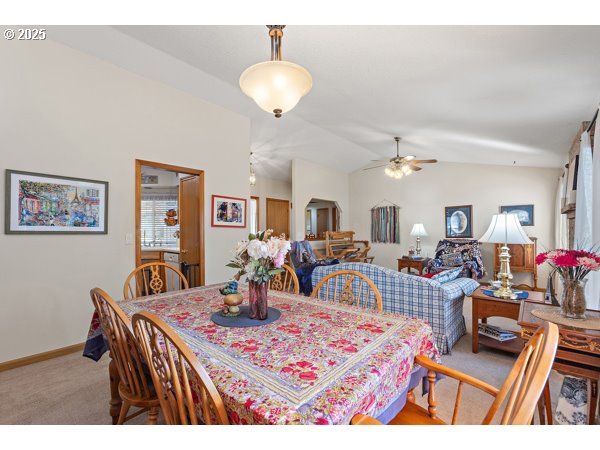 261 Southwest Nancy Circle Gresham, OR 97030 - Photo 5 of 25 a living room with lots of furniture and view of kitchen