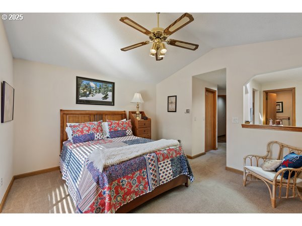 261 Southwest Nancy Circle Gresham, OR 97030 - Photo 10 of 25 a bedroom with a bed and a chandelier