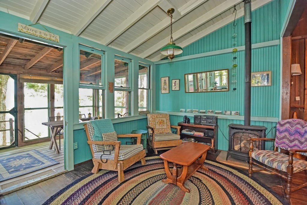 192 Red Gable Road East Brookfield, MA 01515 - Photo 21 of 42 a living room with furniture a fireplace and a window