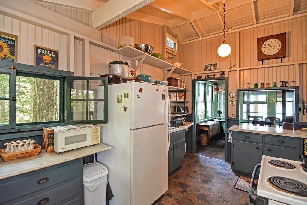 192 Red Gable Road East Brookfield, MA 01515 - Photo 9 of 42 a kitchen with a refrigerator and a stove