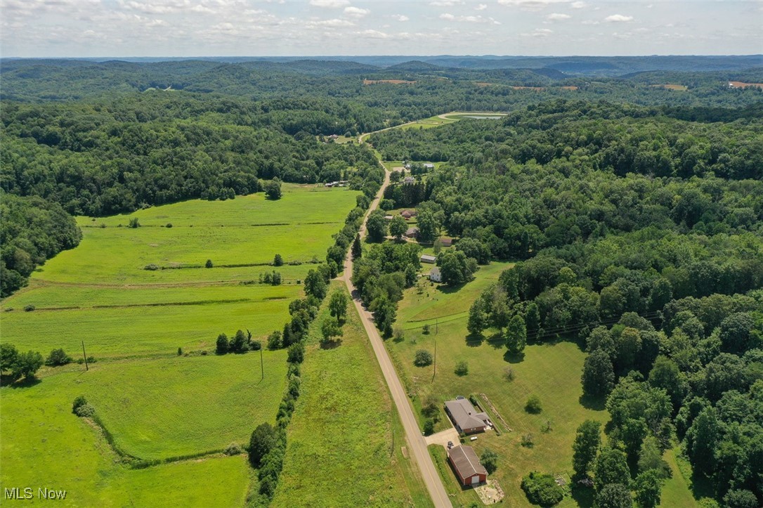 1728 Tall Timber Road Northeast New Philadelphia, OH 44663 - Photo 18 of 39 Overview of rural landscape with a heavily wooded area