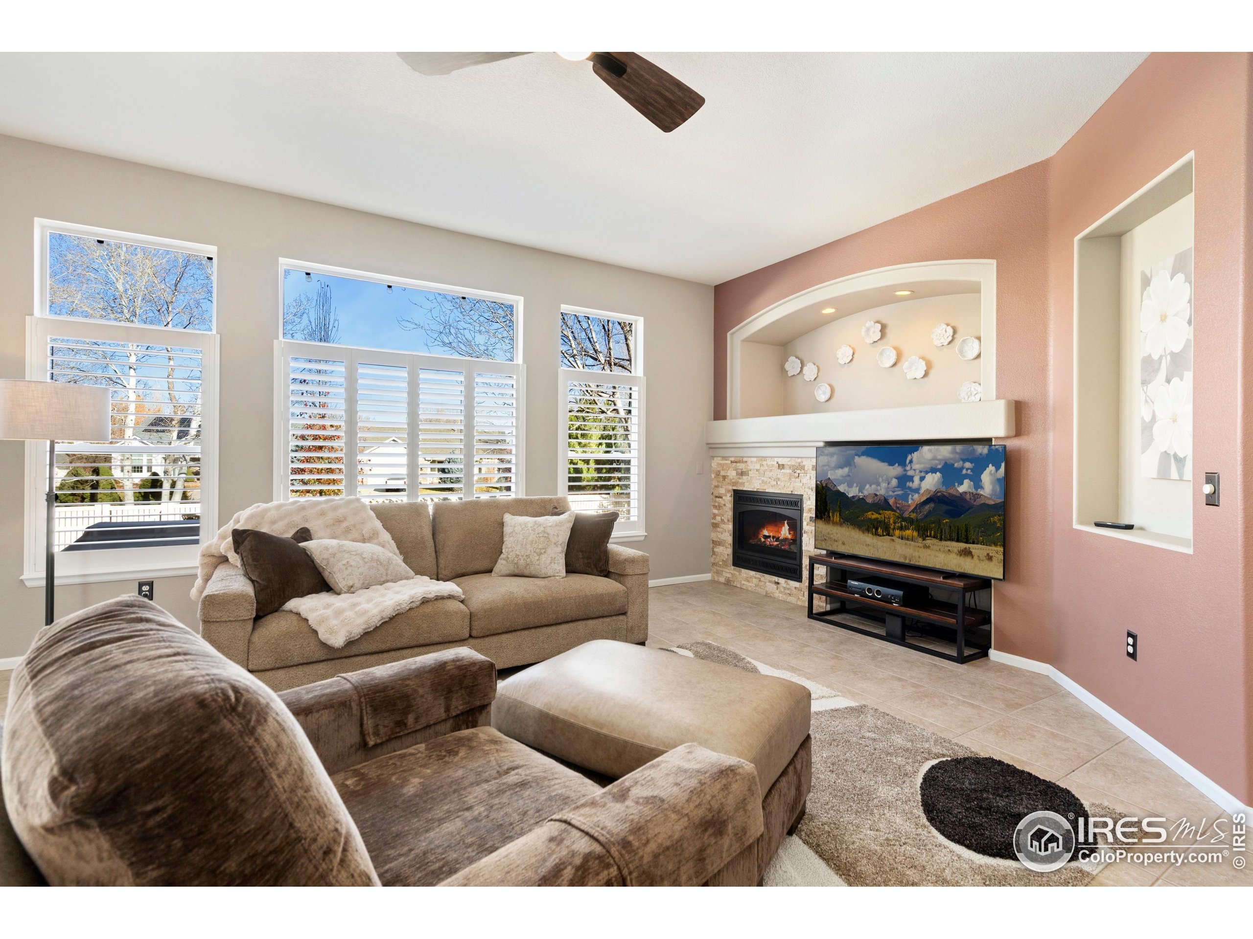 6685 Sage Avenue Firestone, CO 80504 - Photo 12 of 22 a living room with furniture and a flat screen tv