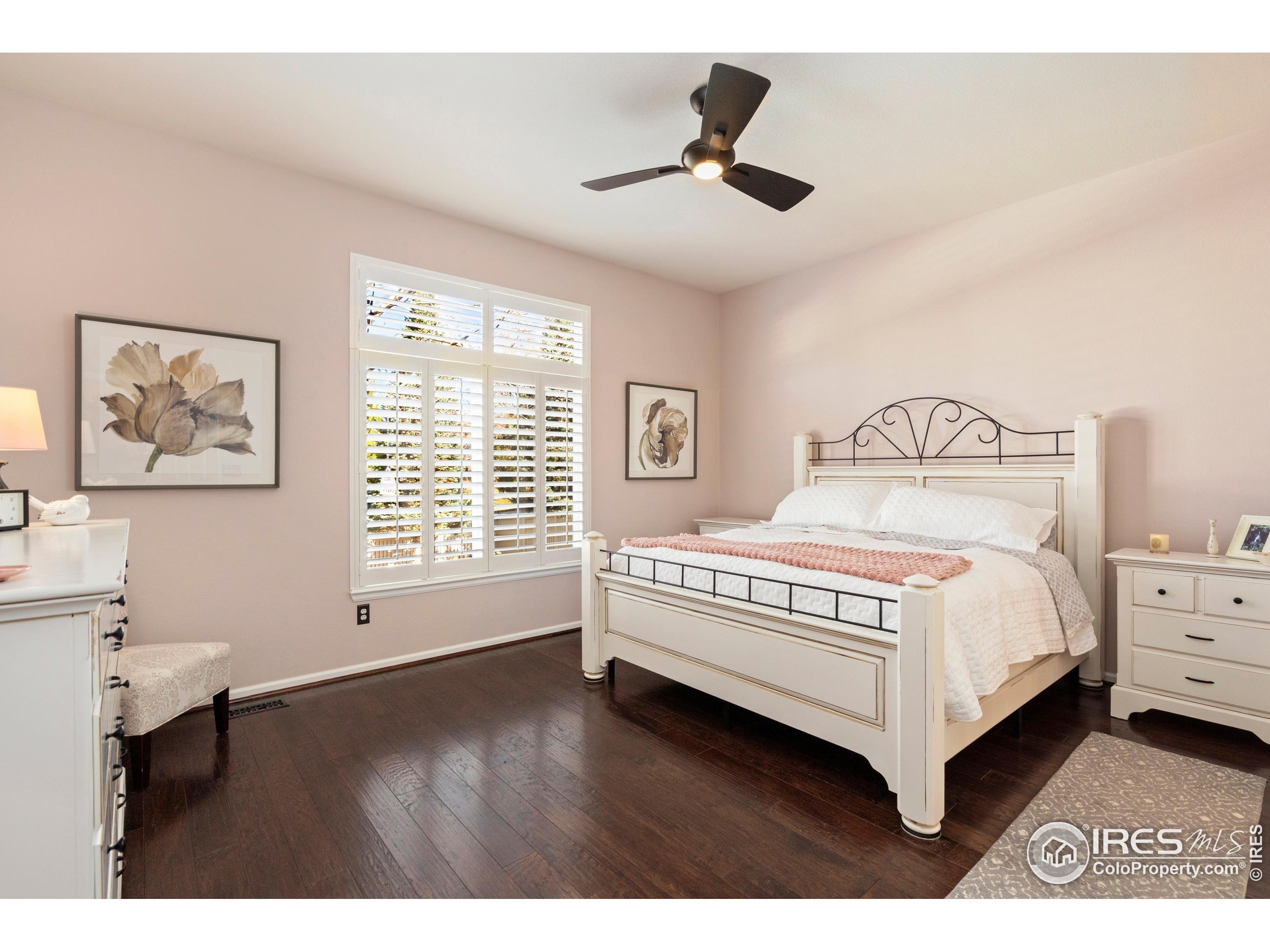 6685 Sage Avenue Firestone, CO 80504 - Photo 14 of 22 a bedroom with a bed and a large window