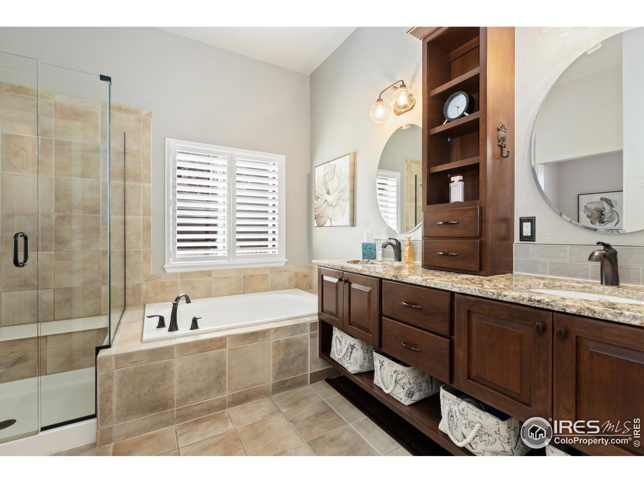 6685 Sage Avenue Firestone, CO 80504 - Photo 16 of 22 a bathroom with a tub sink and mirror