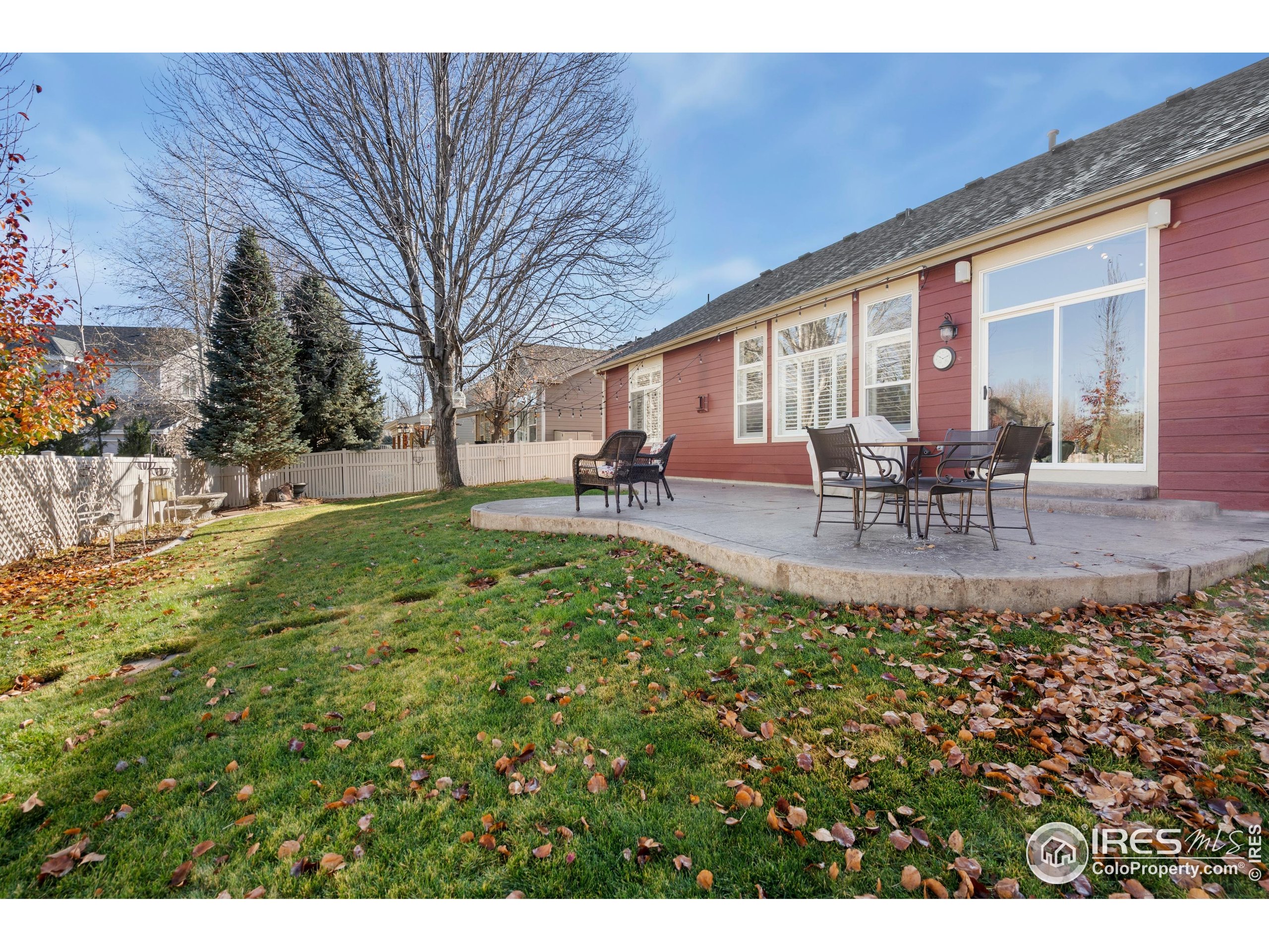 6685 Sage Avenue Firestone, CO 80504 - Photo 22 of 22 a view of a house with backyard porch and sitting area