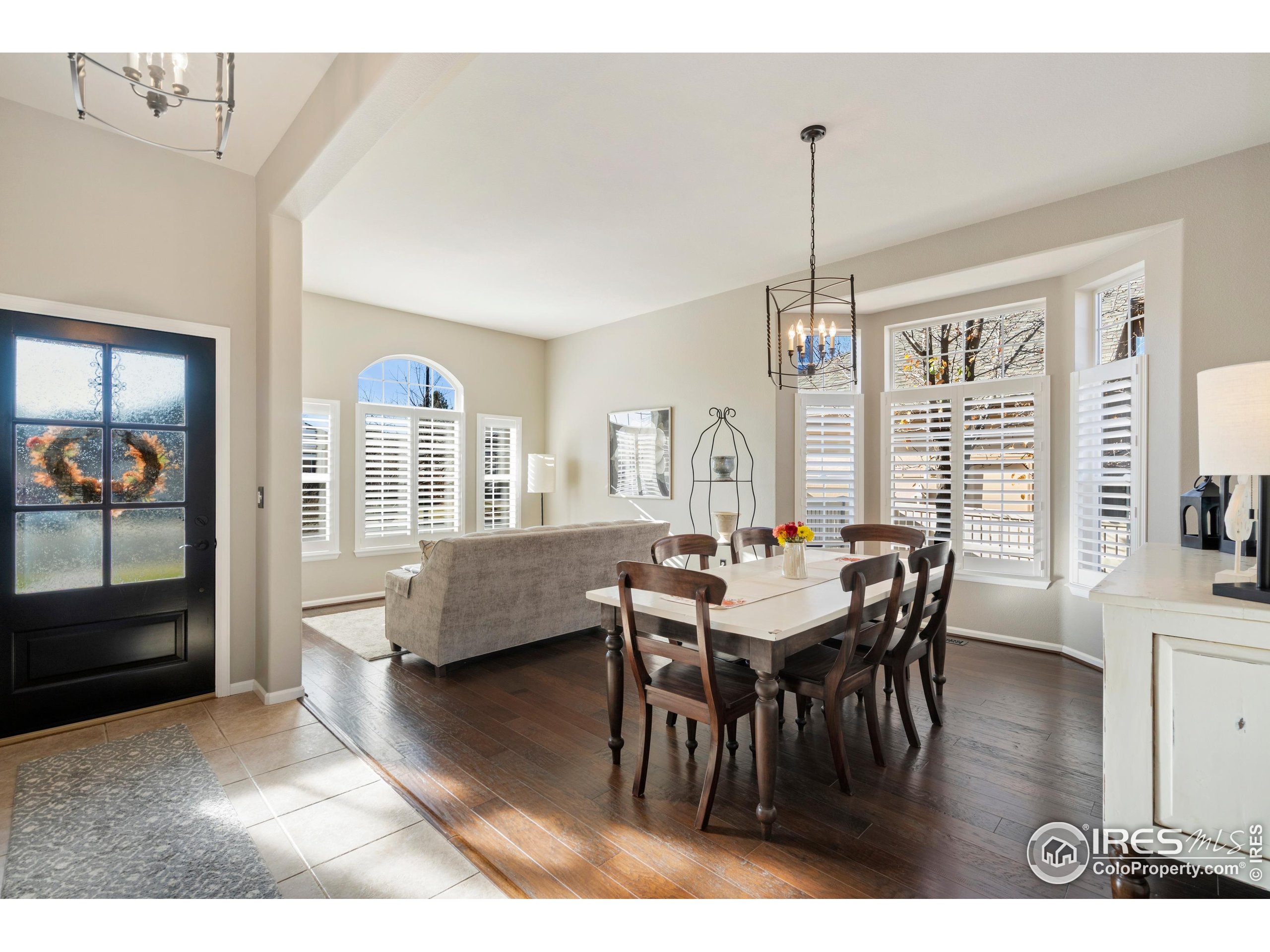 6685 Sage Avenue Firestone, CO 80504 - Photo 5 of 22 a dining room with furniture window wooden floor