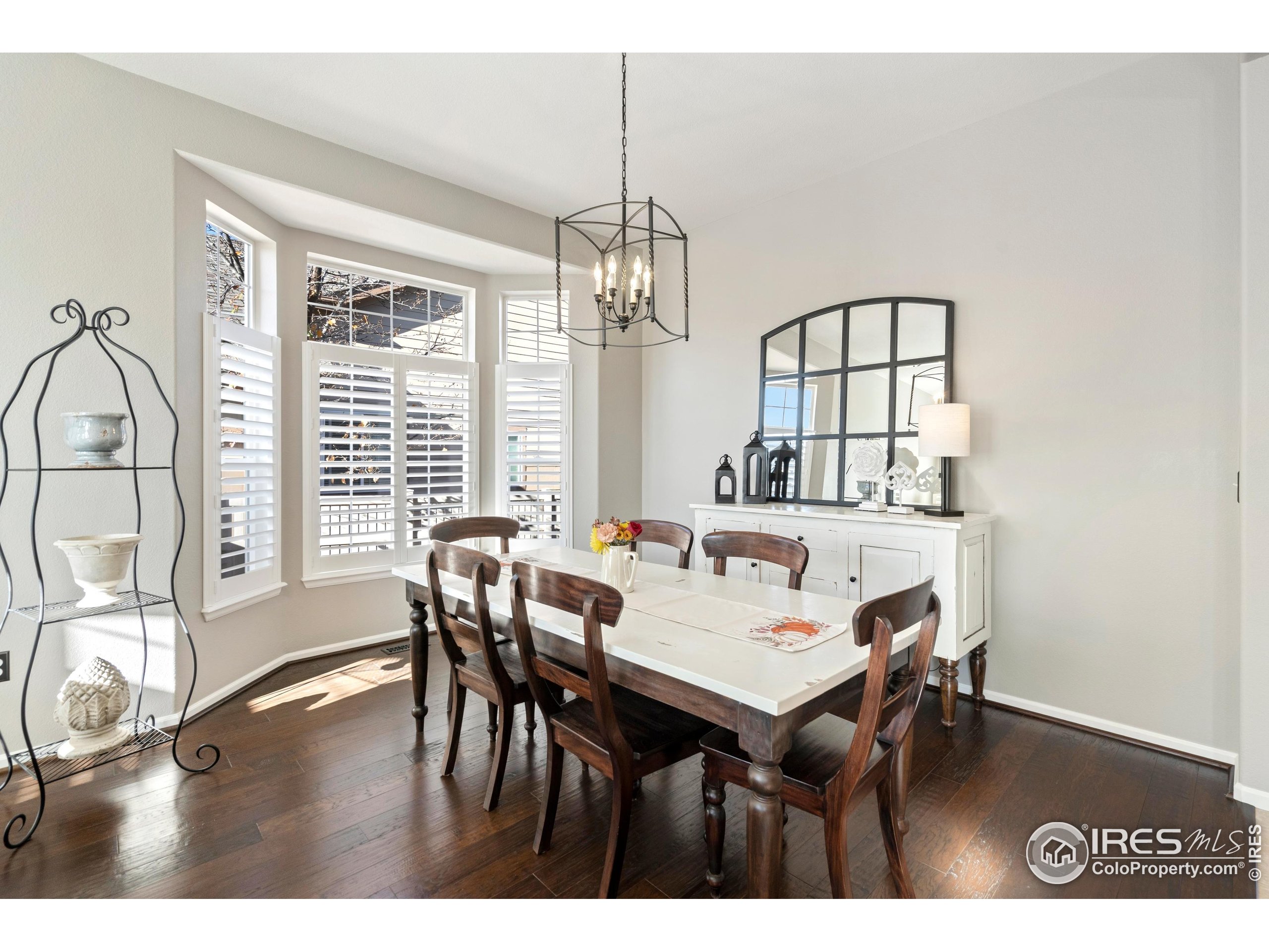 6685 Sage Avenue Firestone, CO 80504 - Photo 6 of 22 a view of a dining room with furniture window and outside view