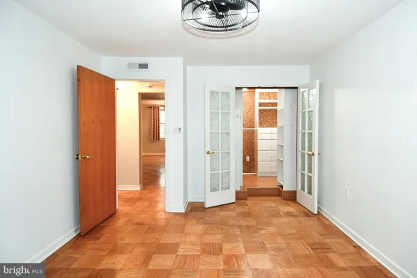 a view of an empty room with a window
