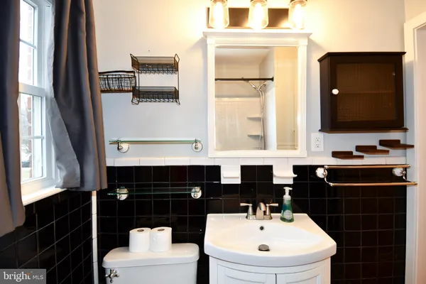 a bathroom with a tub and a shower