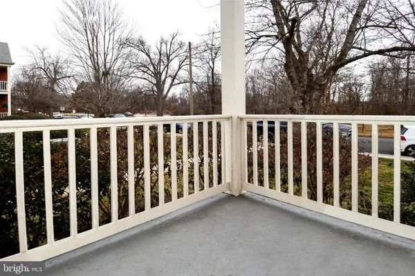 a view of a brick house with a yard
