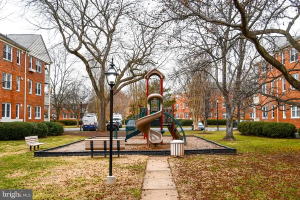 a view of a swimming pool with a yard