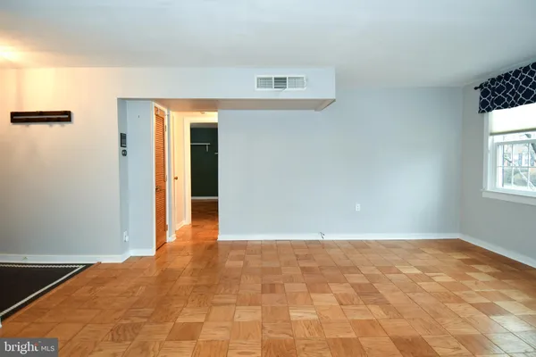a view of an empty room and window