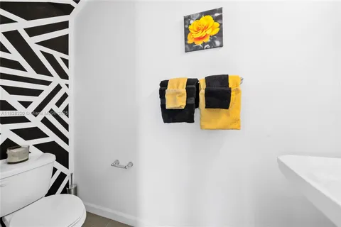 a bathroom with a toilet and a sink