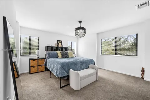 a bed room with a bed and a window