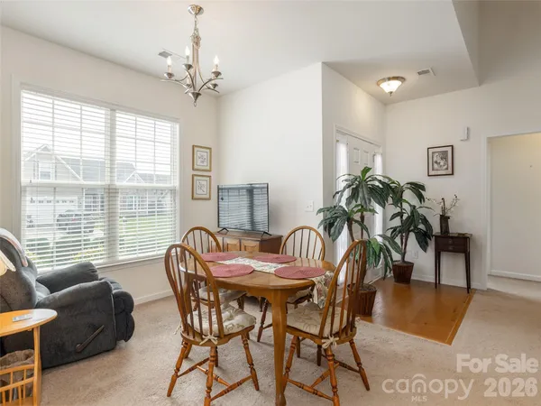 a view of a dining room with furniture window and outside view
