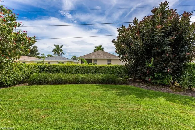a view of a garden in front of a house