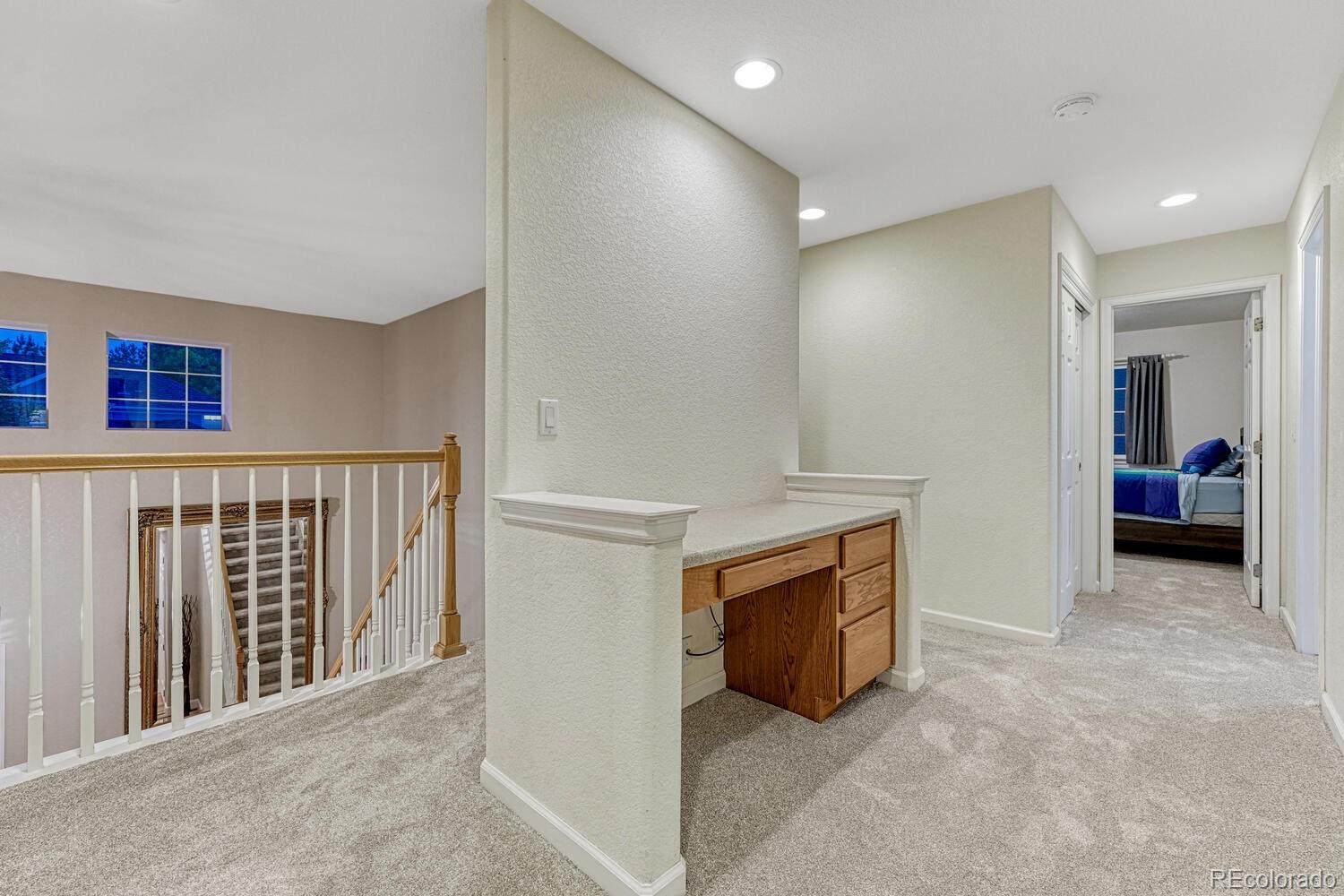 12350 Turquoise Terrace Street Castle Pines, CO 80108 - Photo 18 of 50 a view of an empty room with a fireplace and a window