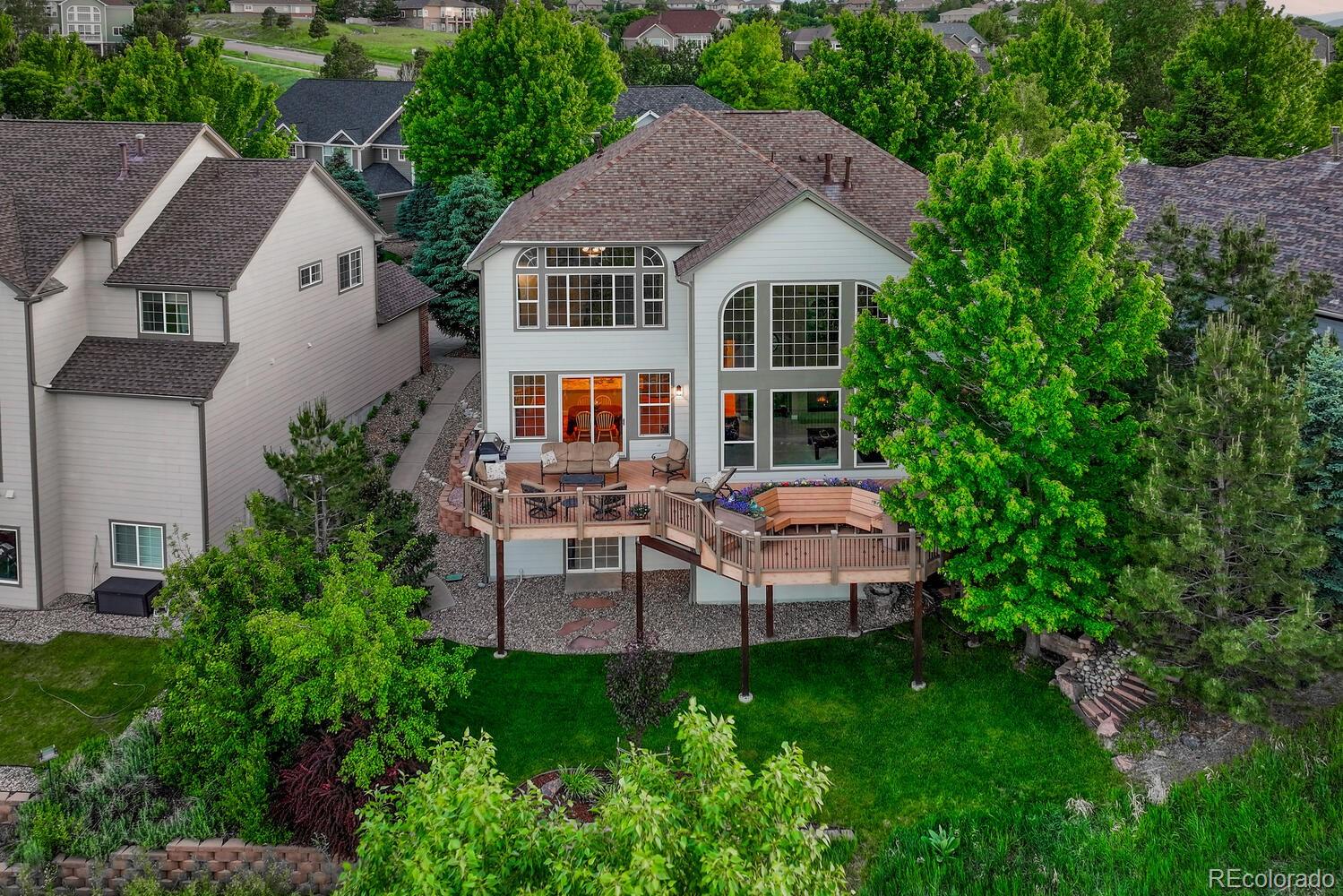 12350 Turquoise Terrace Street Castle Pines, CO 80108 - Photo 2 of 50 a view of a patio with table and chairs and potted plants