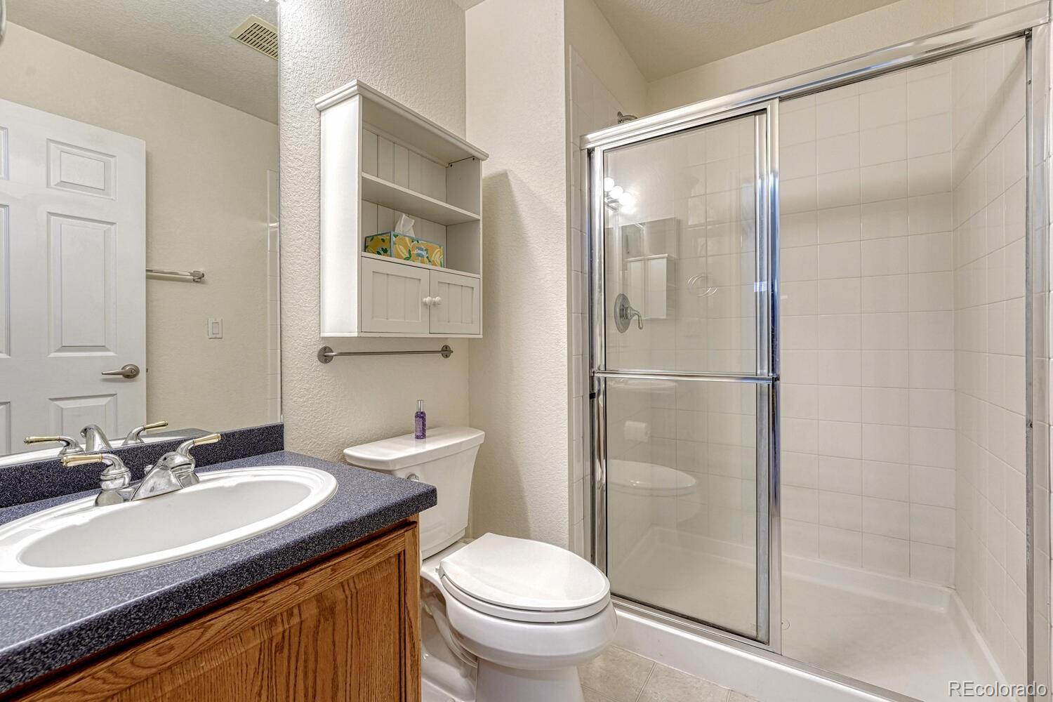 12350 Turquoise Terrace Street Castle Pines, CO 80108 - Photo 28 of 50 a bathroom with a sink toilet and shower