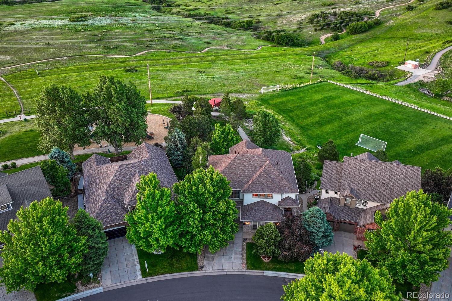 12350 Turquoise Terrace Street Castle Pines, CO 80108 - Photo 3 of 50 an aerial view of residential houses with outdoor space and trees all around