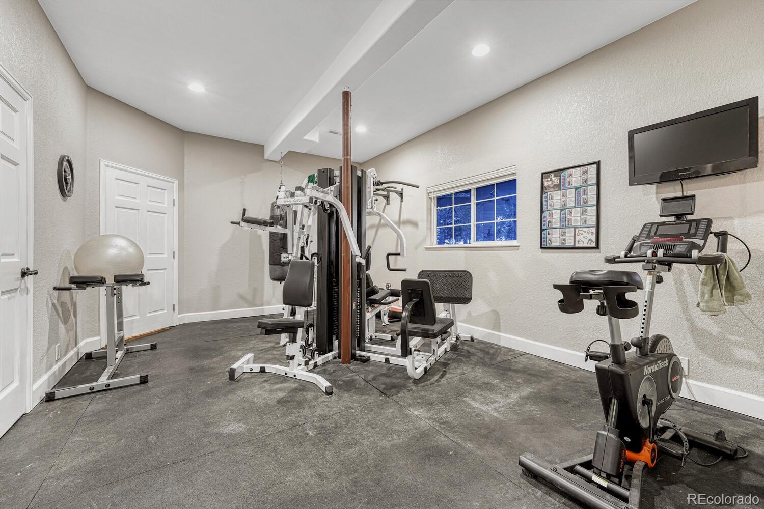 12350 Turquoise Terrace Street Castle Pines, CO 80108 - Photo 32 of 50 a view of a room with gym equipment