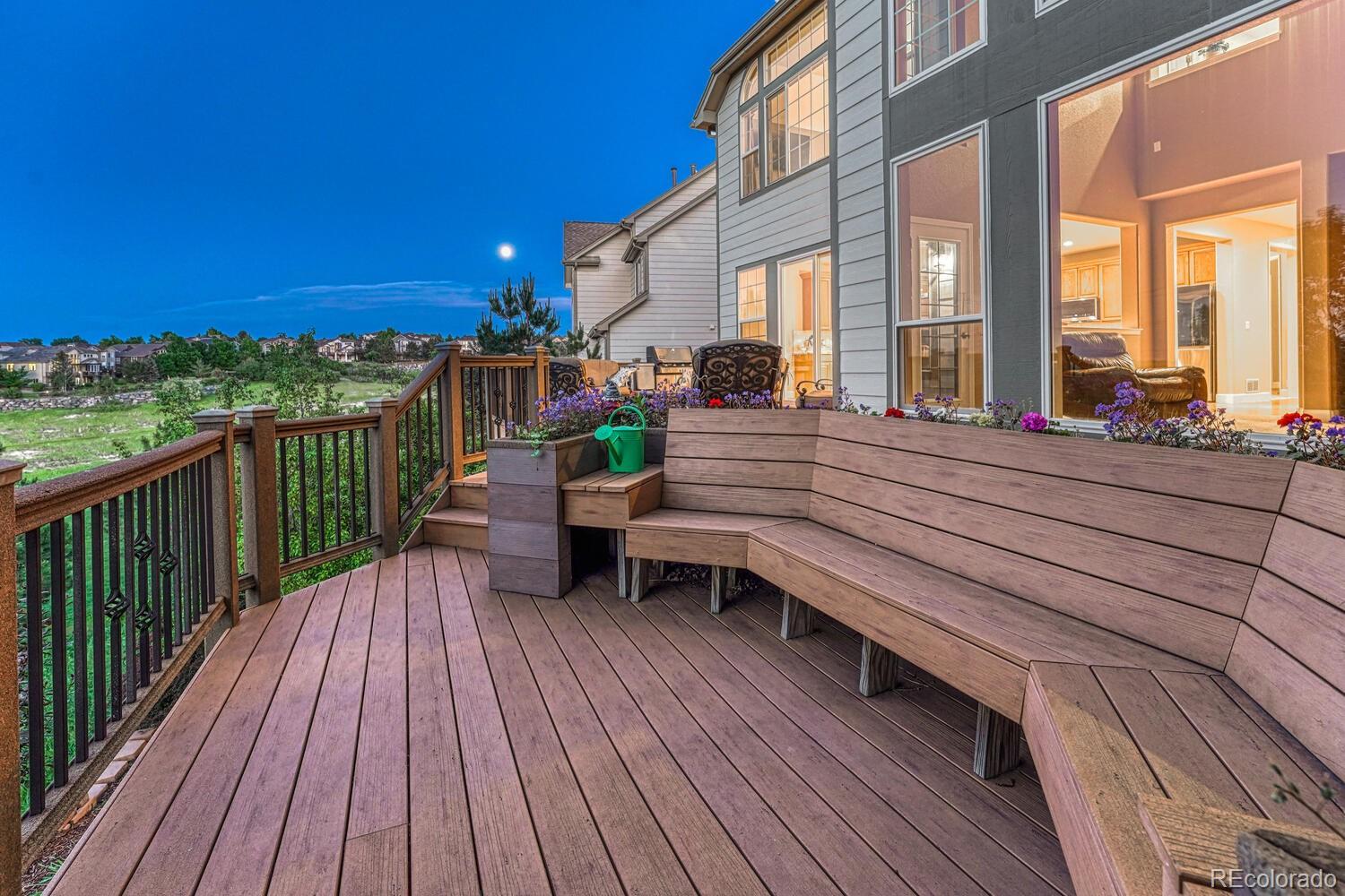 12350 Turquoise Terrace Street Castle Pines, CO 80108 - Photo 39 of 50 a view of a patio with couches chairs and wooden floor