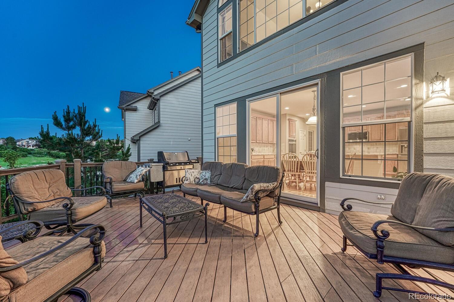 12350 Turquoise Terrace Street Castle Pines, CO 80108 - Photo 41 of 50 a living room with furniture and a wooden floor