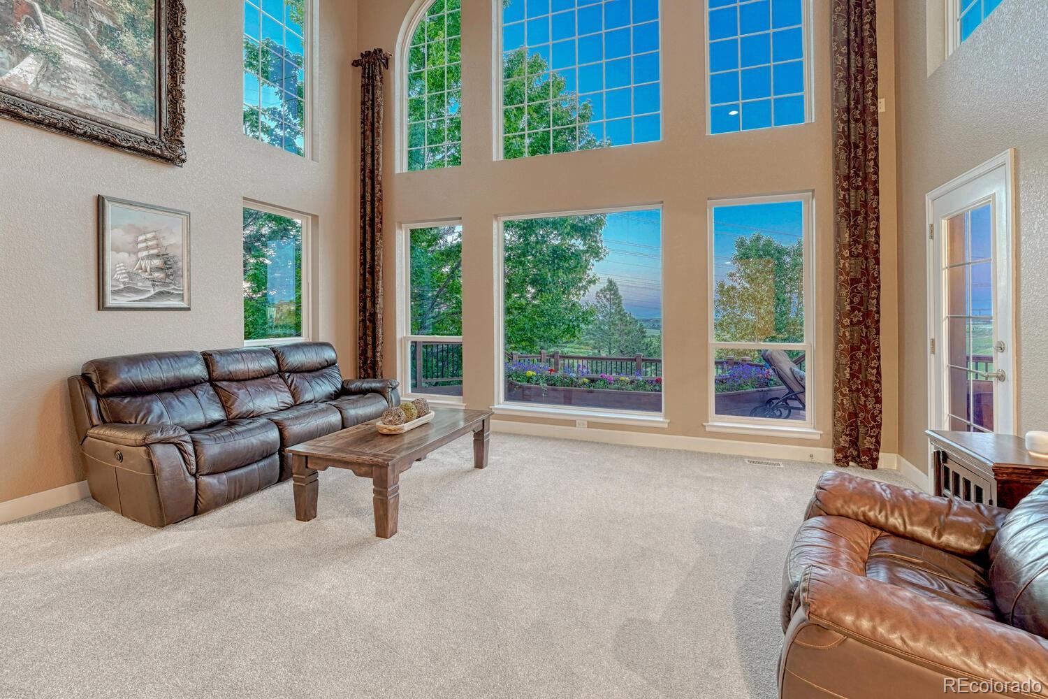 12350 Turquoise Terrace Street Castle Pines, CO 80108 - Photo 8 of 50 a living room with furniture and a window