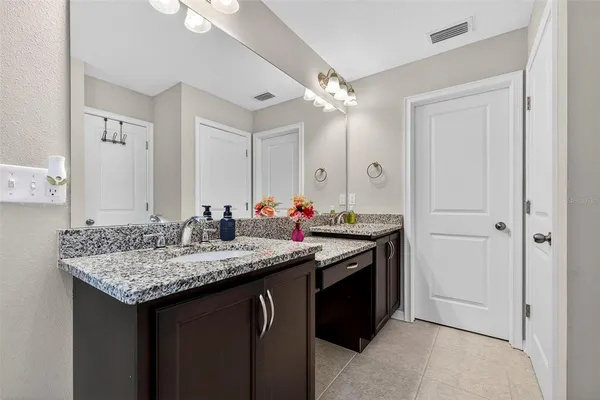 a bathroom with a glass shower door