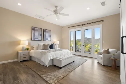 an empty room with wooden floor and a window
