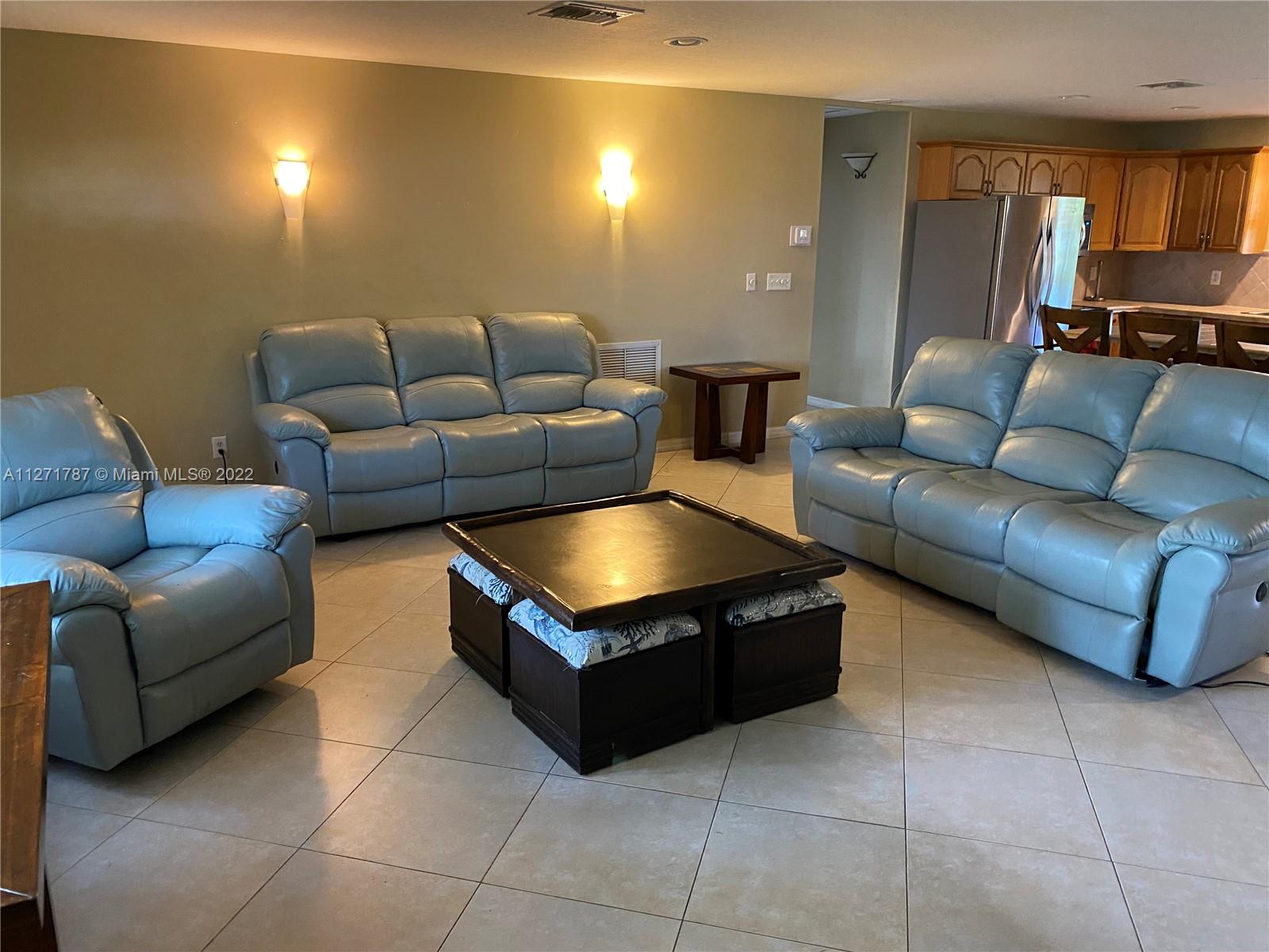 1672 Thumb Point Drive Fort Pierce, FL 34949 - Photo 11 of 29 a living room with furniture and a couch