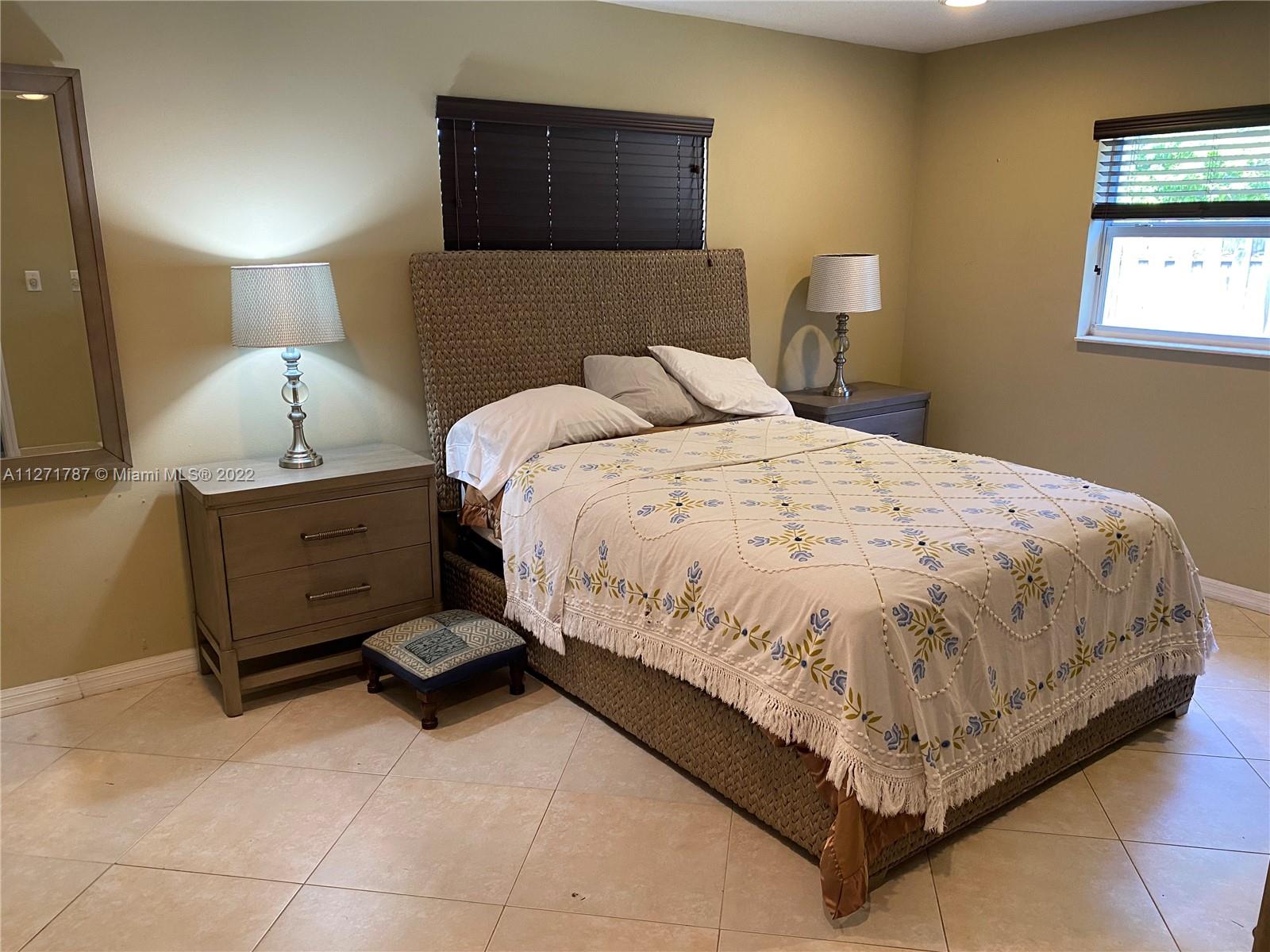 1672 Thumb Point Drive Fort Pierce, FL 34949 - Photo 16 of 29 a bed room with a bed and a night stand