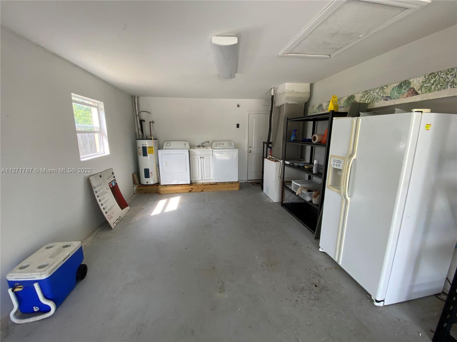 1672 Thumb Point Drive Fort Pierce, FL 34949 - Photo 27 of 29 a view of empty room with a refrigerator