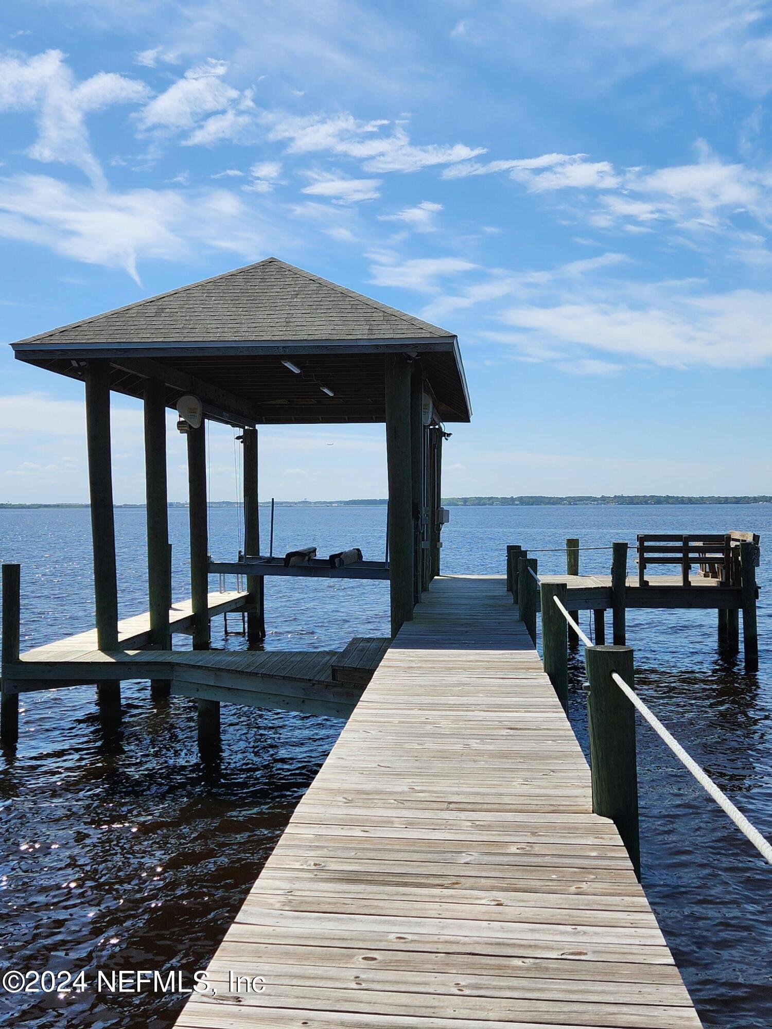 4294 Point La Vista Road West Jacksonville, FL 32207 - Photo 11 of 15 a view of a balcony with wooden floor and iron stairs