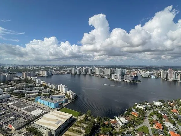 a bed room with a bed and a mirror