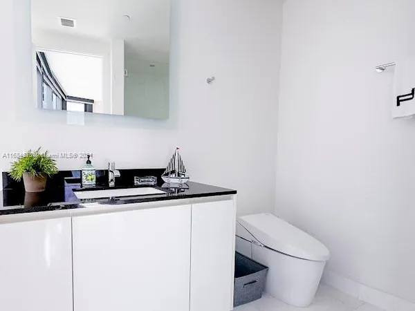 wooden floor in a hall with a couch